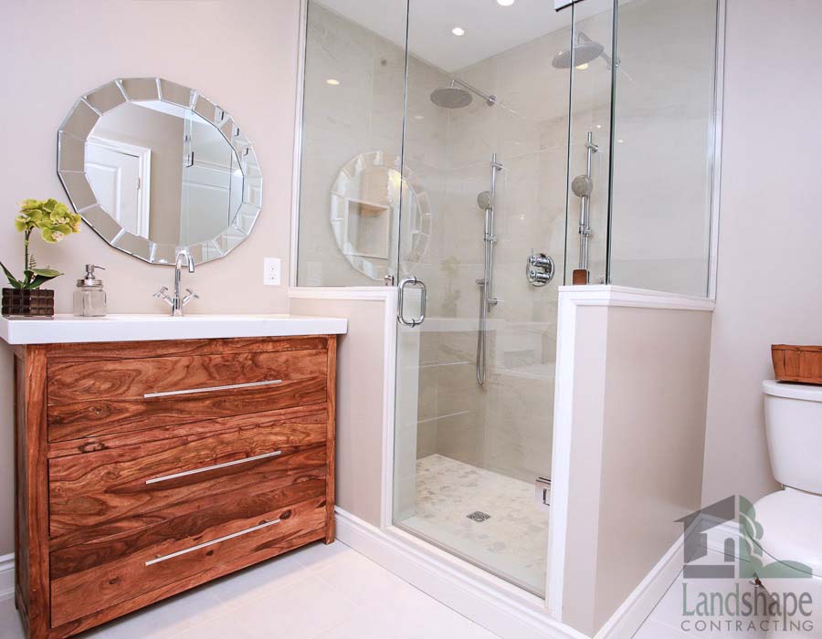 full bathroom with glass shower door in basement