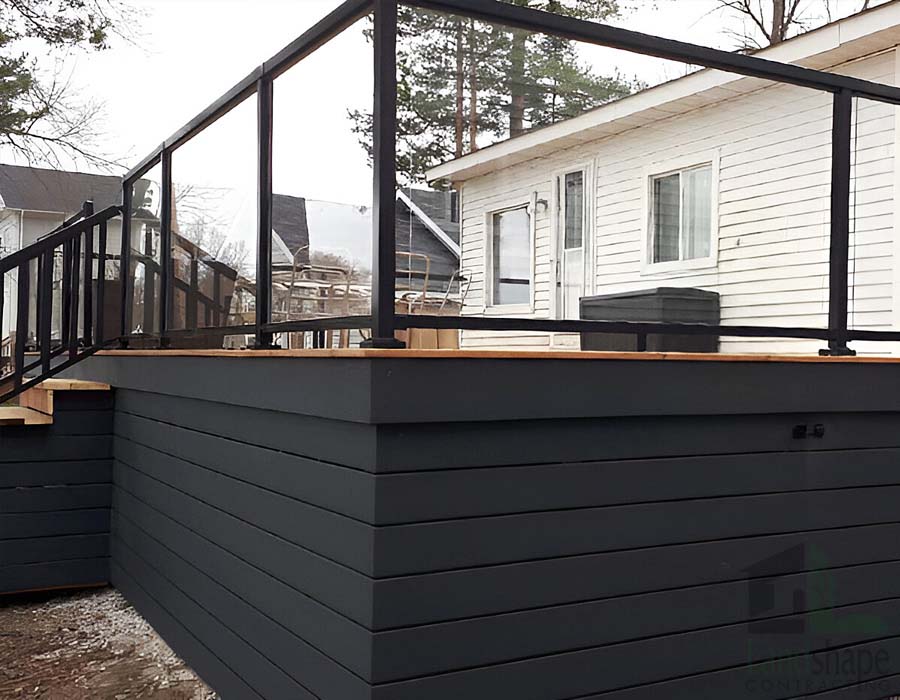 Landshape Contracting Basement Renovations and Decks - Modern Deck Built With Lights and Custom Glass Railing